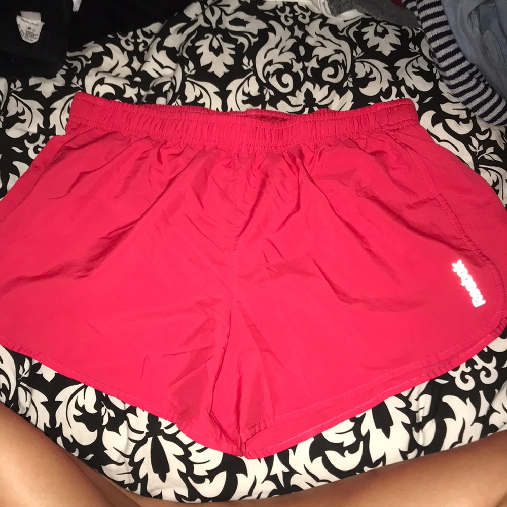 Fuchsia Reebok running shorts